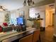 Open concept living area with a fireplace and sliding doors to an outdoor space at 8324 W Charleston Blvd # 1036, Las Vegas, NV 89117