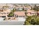Aerial view of a single-Gathering home featuring mature trees, well-kept lawns, and a terracotta roof at 8326 Mount Nido Dr, Las Vegas, NV 89147