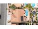 Aerial view showcases backyard pool, desert landscaping, and a tile roof with solar panels at 8326 Mount Nido Dr, Las Vegas, NV 89147