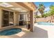 Backyard area featuring a pool with spa, covered patio, and outdoor bar at 8326 Mount Nido Dr, Las Vegas, NV 89147