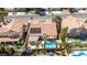Resort-style backyard with a swimming pool, patio, outdoor furniture, and desert landscaping at 8326 Mount Nido Dr, Las Vegas, NV 89147