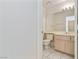 Bathroom with tile flooring, a toilet, and a light wood vanity at 8326 Mount Nido Dr, Las Vegas, NV 89147