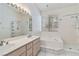 Bathroom with double sinks, tile floor and bathtub at 8326 Mount Nido Dr, Las Vegas, NV 89147