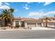 Charming home with a three-car garage, desert landscaping, and a tile roof with great curb appeal at 8326 Mount Nido Dr, Las Vegas, NV 89147