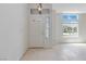 Bright and airy foyer with tile flooring, a view of the neighborhood, and plenty of natural light at 8326 Mount Nido Dr, Las Vegas, NV 89147