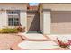 Inviting front entrance with a security gate and desert landscaping at 8326 Mount Nido Dr, Las Vegas, NV 89147