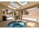 Enclosed patio with a relaxing hot tub and scenic backyard views, perfect for entertaining at 8326 Mount Nido Dr, Las Vegas, NV 89147