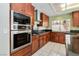 Updated kitchen with stainless steel appliances, gas range, and dark countertops at 8326 Mount Nido Dr, Las Vegas, NV 89147
