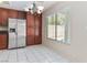 Eat-in kitchen area featuring stainless steel refrigerator and bright natural light at 8326 Mount Nido Dr, Las Vegas, NV 89147