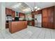 This bright, modern kitchen features an island, stainless appliances and custom cabinetry at 8326 Mount Nido Dr, Las Vegas, NV 89147