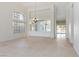 Bright, open living room features tile flooring, built-in cabinets, and backyard pool access at 8326 Mount Nido Dr, Las Vegas, NV 89147