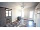 Bedroom with barn door, unique lighting, neutral paint, and vinyl floors at 9000 Litchfield Ave, Las Vegas, NV 89134