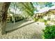 Well-maintained yard with mature trees and beautiful desert landscaping at 9000 Litchfield Ave, Las Vegas, NV 89134