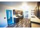 Charming kitchen featuring stainless steel appliances, wood cabinets, and luxury vinyl flooring at 9000 Litchfield Ave, Las Vegas, NV 89134