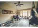 Cozy living room featuring ample natural light from a bay window and stylish wood-look flooring at 9000 Litchfield Ave, Las Vegas, NV 89134