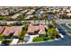 An aerial view of a property with lush landscaping, a well-manicured lawn, and mature shade trees at 10089 Clifton Forge Ave, Las Vegas, NV 89148