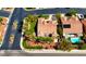 An aerial view reveals a private backyard oasis featuring a pool, well-maintained landscaping, and mature trees at 10089 Clifton Forge Ave, Las Vegas, NV 89148