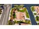 Aerial view of a meticulously landscaped home with verdant lawn, mature trees, and manicured gardens at 10089 Clifton Forge Ave, Las Vegas, NV 89148