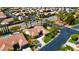 An aerial view showcases a well-maintained residence with manicured lawns, mature trees, and lush landscaping at 10089 Clifton Forge Ave, Las Vegas, NV 89148