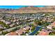 Expansive aerial view of a residential community nestled against a majestic mountain backdrop at 10089 Clifton Forge Ave, Las Vegas, NV 89148