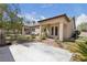 Well-maintained backyard featuring a concrete patio and a custom putting green at 10089 Clifton Forge Ave, Las Vegas, NV 89148