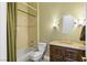 Bathroom featuring a marble vanity, designer lighting, tub/shower, and neutral walls at 10089 Clifton Forge Ave, Las Vegas, NV 89148