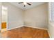 Cozy bedroom with hardwood floors, ceiling fan, and natural light at 10089 Clifton Forge Ave, Las Vegas, NV 89148
