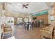 Clubhouse interior featuring a stone fireplace, tables and chairs, and ample natural light at 10089 Clifton Forge Ave, Las Vegas, NV 89148