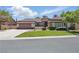 Charming single-story home with a well-manicured lawn, desert landscaping, and a two-car garage at 10089 Clifton Forge Ave, Las Vegas, NV 89148