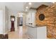 Inviting foyer with stone accent wall and tile flooring at 10089 Clifton Forge Ave, Las Vegas, NV 89148