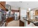 Gourmet kitchen featuring stainless steel appliances and a granite-topped island at 10089 Clifton Forge Ave, Las Vegas, NV 89148