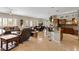 Spacious living area featuring a breakfast bar, dining area, and cozy seating arrangement at 10089 Clifton Forge Ave, Las Vegas, NV 89148