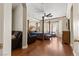 Spacious main bedroom with wood floors, four-poster bed, seating and french doors at 10089 Clifton Forge Ave, Las Vegas, NV 89148