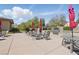 Community outdoor seating area provides a relaxing atmosphere with patio furniture and shade umbrellas at 10089 Clifton Forge Ave, Las Vegas, NV 89148
