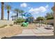 Neighborhood playground with slides and a small climbing wall, surrounded by palm trees and manicured hedges at 10089 Clifton Forge Ave, Las Vegas, NV 89148