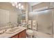 Bathroom with tiled shower and ample vanity space at 10314 Premia Pl, Las Vegas, NV 89135