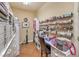 Functional craft room features ample storage shelves and countertop space at 10314 Premia Pl, Las Vegas, NV 89135
