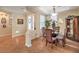 Bright dining area features tile flooring, elegant lighting, and a decorative china cabinet at 10314 Premia Pl, Las Vegas, NV 89135