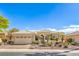 Beautiful single-story home with a two-car garage and desert landscaping in a gated community at 10314 Premia Pl, Las Vegas, NV 89135