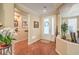 Bright foyer featuring tile flooring that leads into the home's dining and living spaces at 10314 Premia Pl, Las Vegas, NV 89135