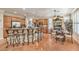 Spacious kitchen with tiled floor, stainless appliances, island, and views to the breakfast nook at 10314 Premia Pl, Las Vegas, NV 89135
