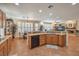 Open kitchen floorplan features granite countertops, stainless appliances, and ample natural light at 10314 Premia Pl, Las Vegas, NV 89135