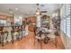 Open kitchen layout with tiled flooring, a breakfast bar, and views to a cozy breakfast nook at 10314 Premia Pl, Las Vegas, NV 89135