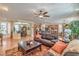 Spacious living room open to the dining area and kitchen, complete with comfortable seating at 10314 Premia Pl, Las Vegas, NV 89135