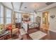Elegant main bedroom featuring hardwood floors, decorative ceiling, and a wrought iron bed frame at 10314 Premia Pl, Las Vegas, NV 89135