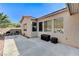 Backyard with a concrete patio, exterior views, and minimal landscaping at 10410 Nostalgia Cir, Las Vegas, NV 89135