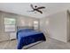 Serene bedroom with a plush bed, soft lighting, and ample natural light from the windows at 10410 Nostalgia Cir, Las Vegas, NV 89135