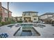 Spacious backyard featuring a swimming pool, jacuzzi, lush landscaping, and covered patio at 11345 Espadrille Ct, Las Vegas, NV 89138