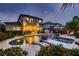 A gorgeous backyard and patio view of the outdoor pool and spa at twilight at 11345 Espadrille Ct, Las Vegas, NV 89138