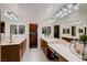 Luxury bathroom with dual vanities, abundant storage, and a well-lit vanity area at 11345 Espadrille Ct, Las Vegas, NV 89138